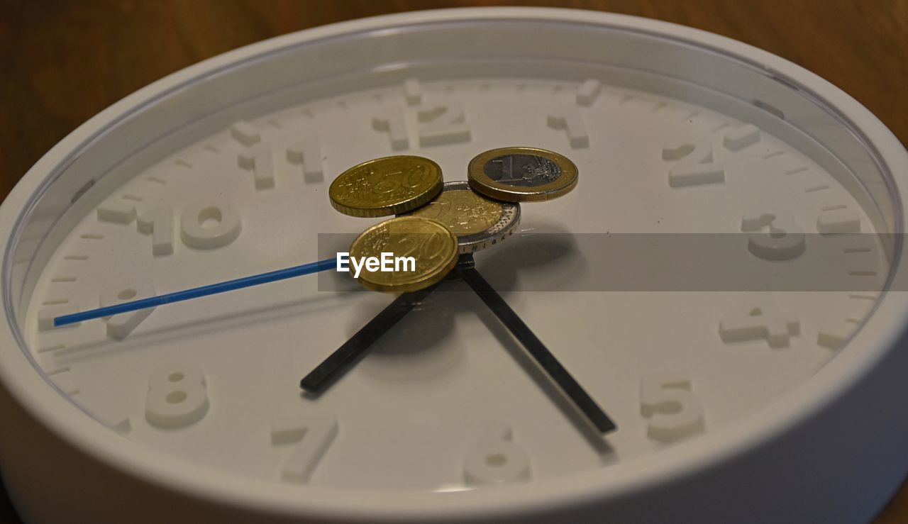 HIGH ANGLE VIEW OF CLOCK WITH ELECTRIC LAMP