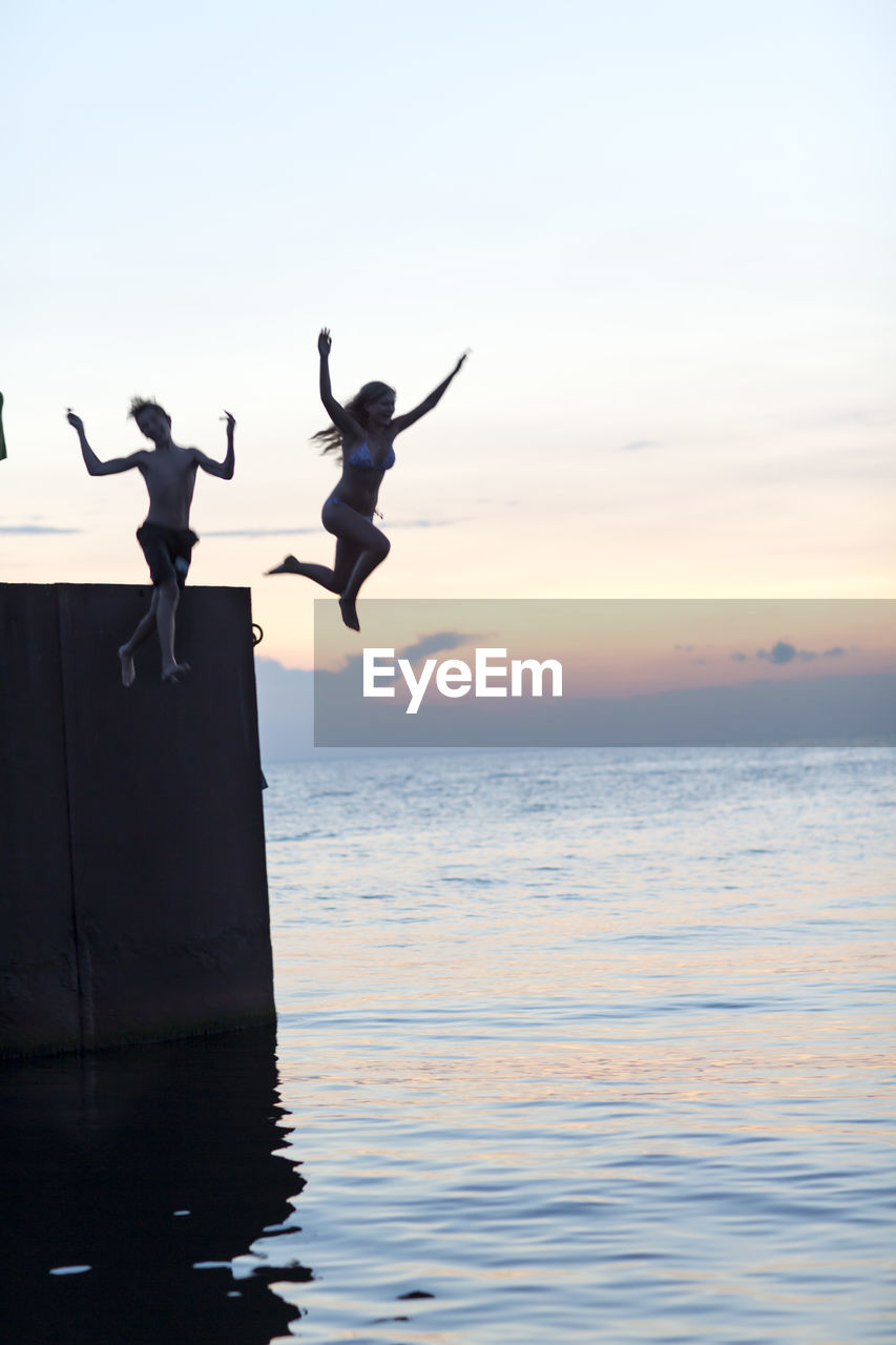 Youth jumping into sea, oland, sweden