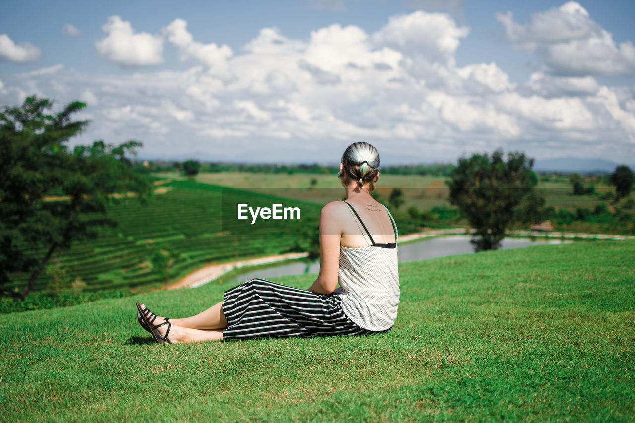 Woman sitting on grass