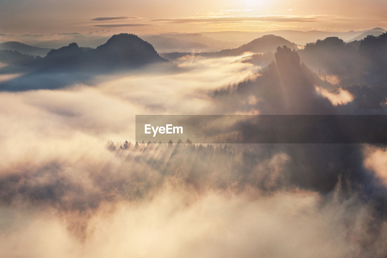 Scenic view of mountains against sky during sunset