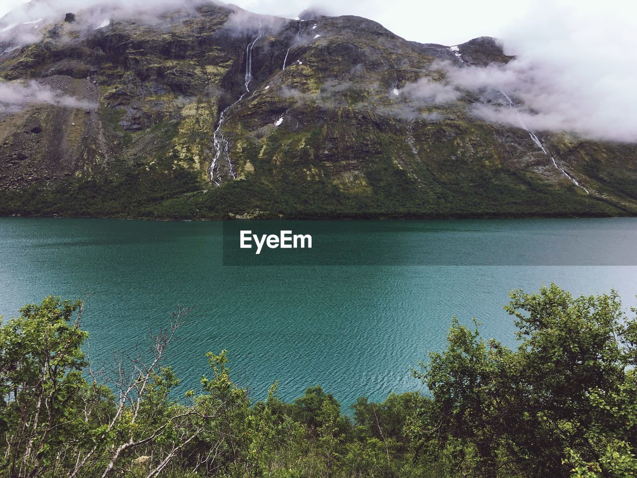 SCENIC VIEW OF SEA AND MOUNTAIN