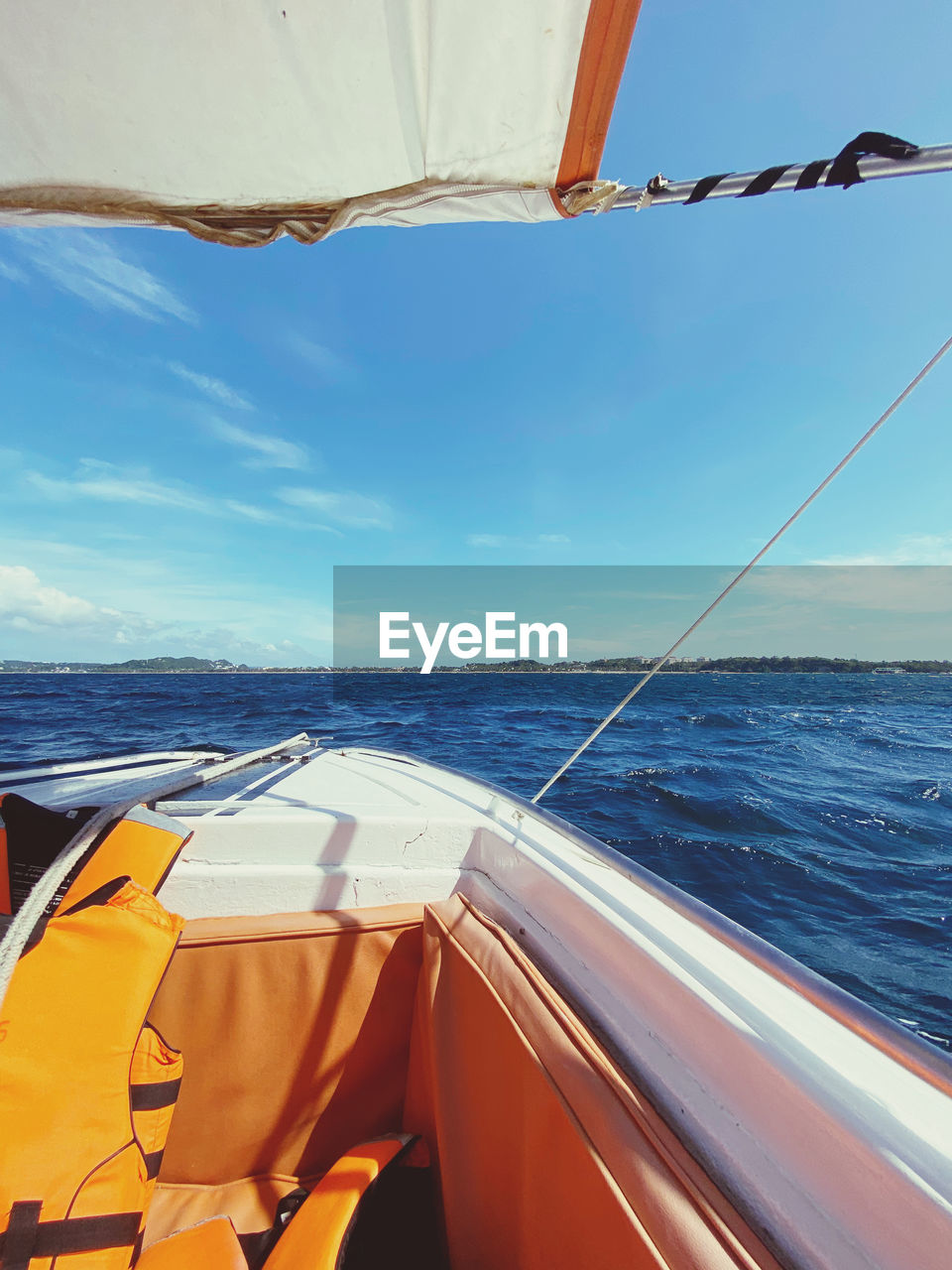 boat sailing in sea against sky