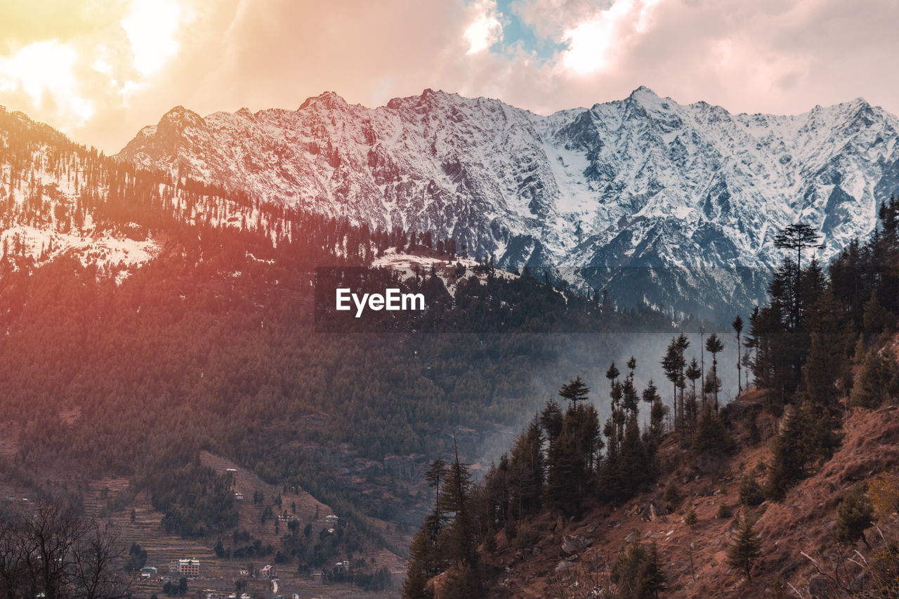 PANORAMIC SHOT OF SNOWCAPPED MOUNTAINS AGAINST SKY