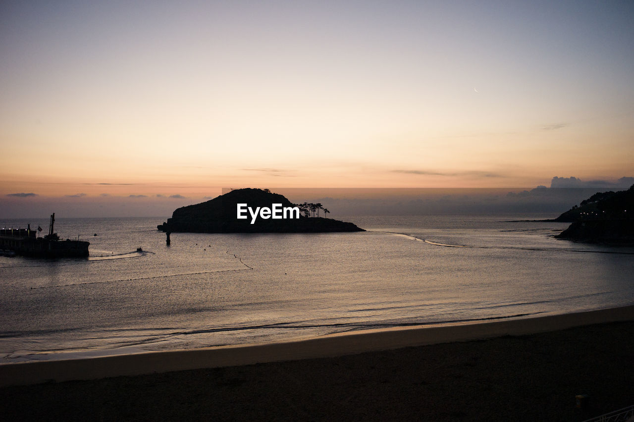 Scenic view of sea against sky during sunset