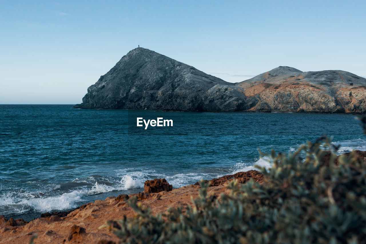 Scenic view of sea against clear sky