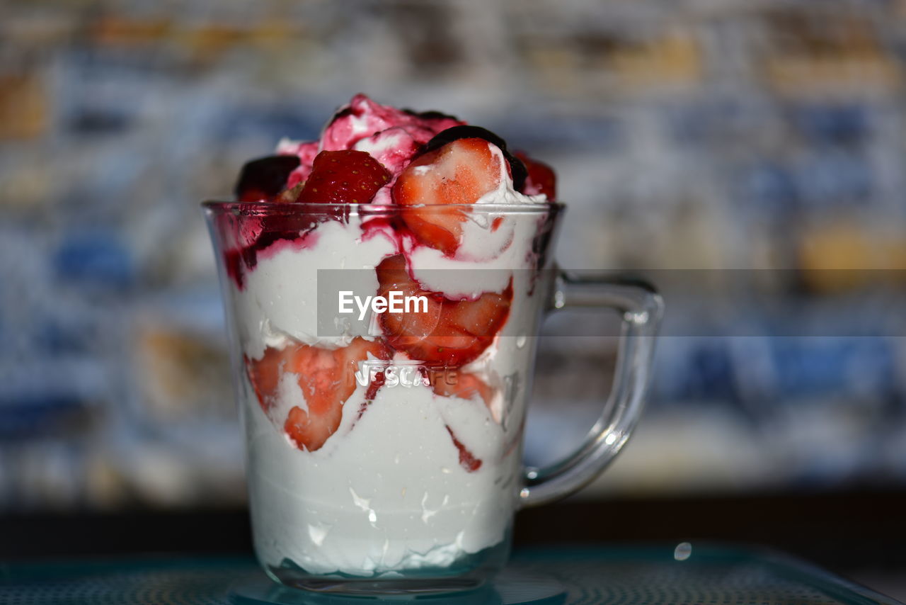 CLOSE-UP OF ICE CREAM IN GLASS