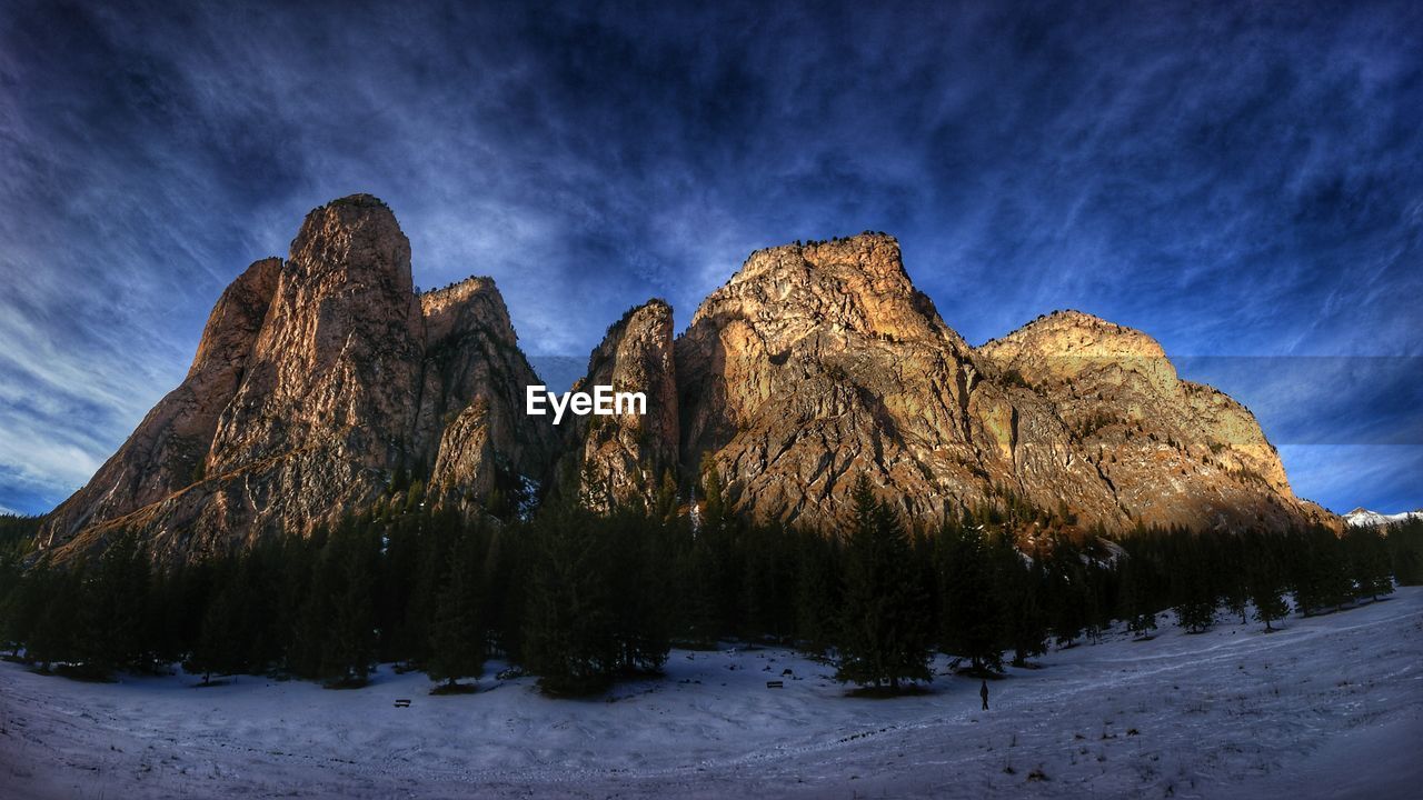 Scenic view of snowcapped mountains against sky during winter