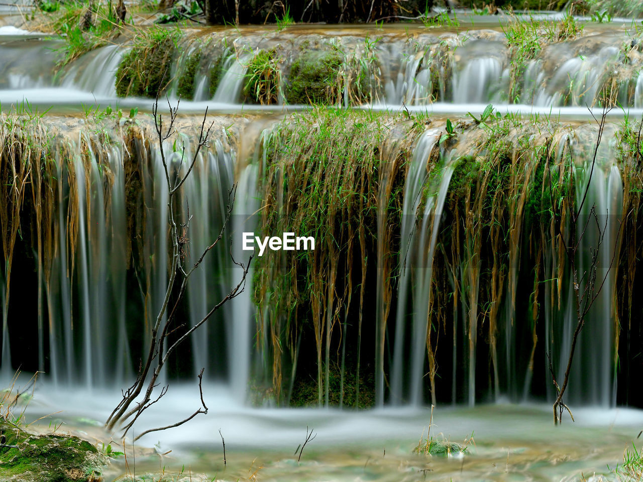 SCENIC VIEW OF WATERFALL ON LAND
