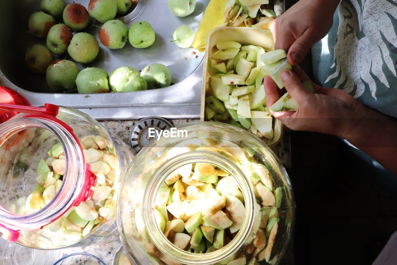 Midsection of person holding fruits