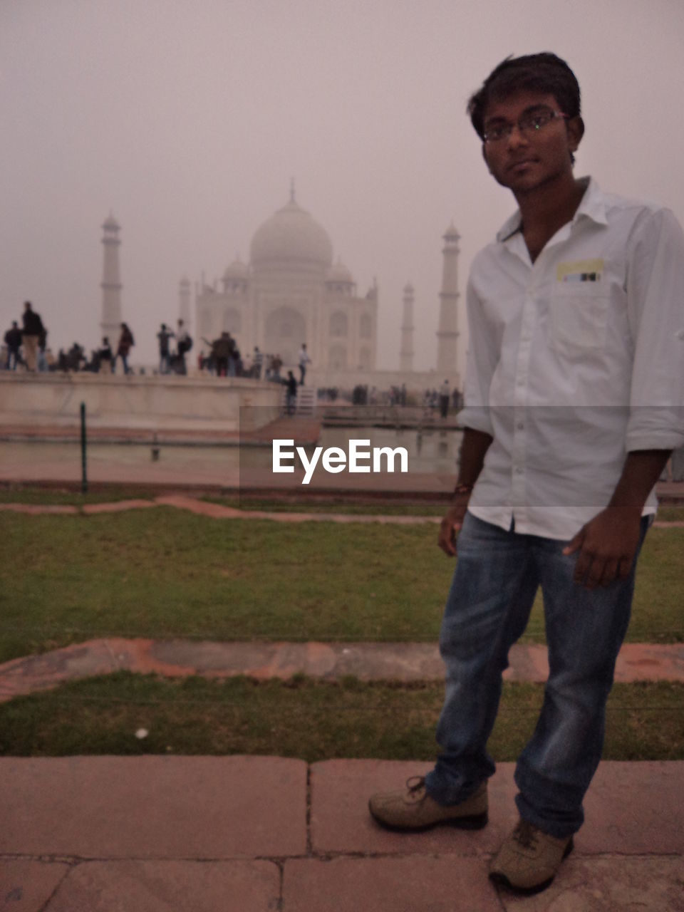 FULL LENGTH OF MAN STANDING AGAINST TEMPLE