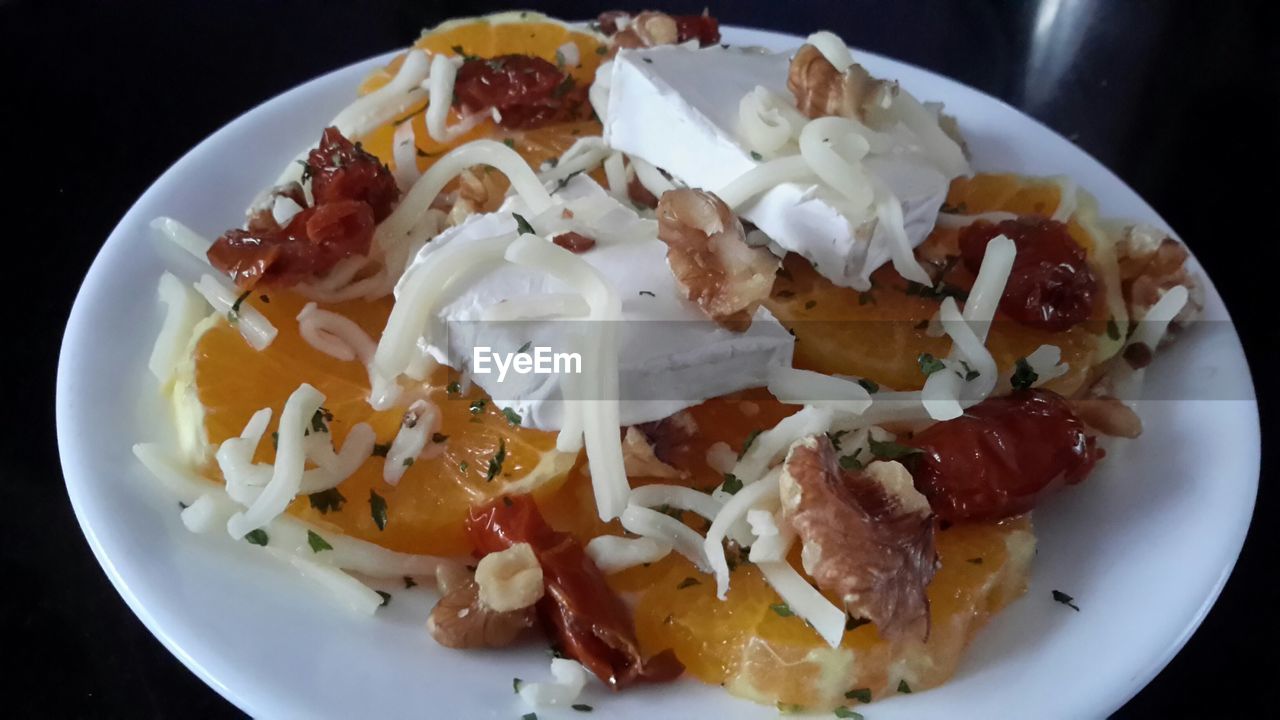 Close-up of meat salad with cheese served in plate