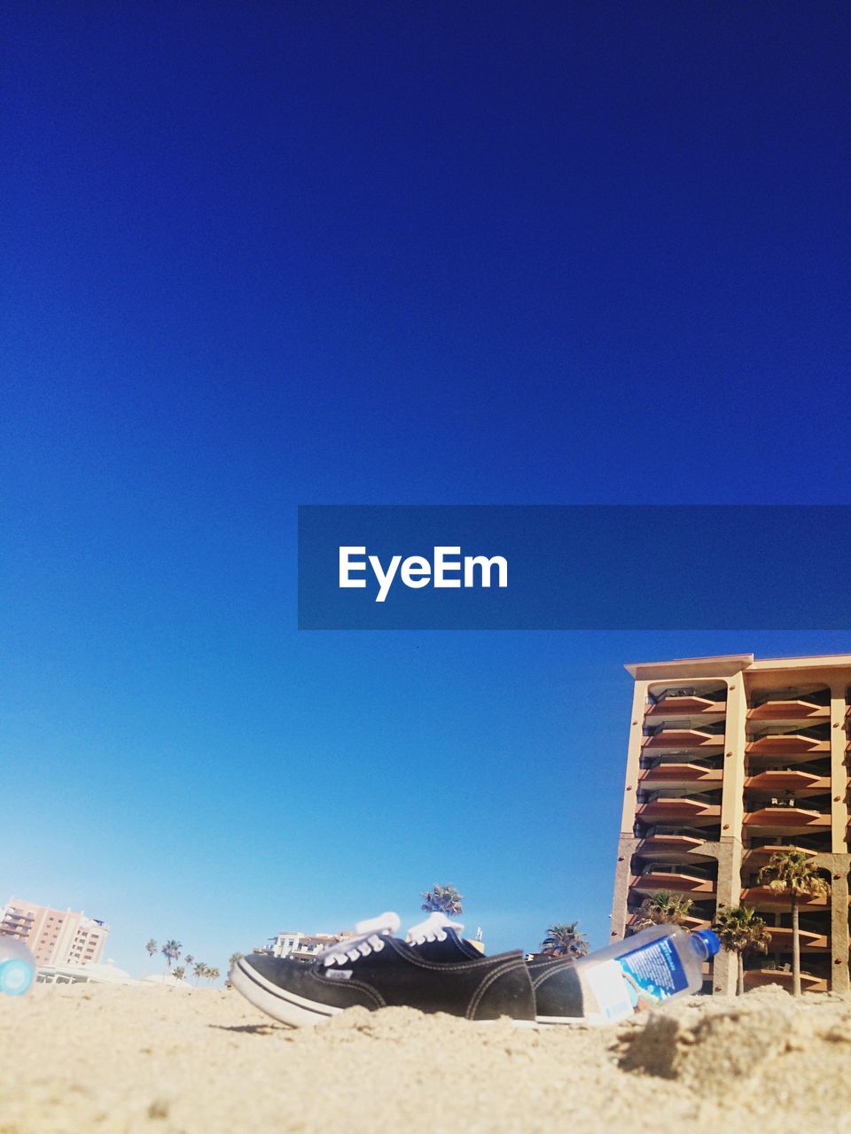 PANORAMIC SHOT OF BEACH AGAINST CLEAR BLUE SKY