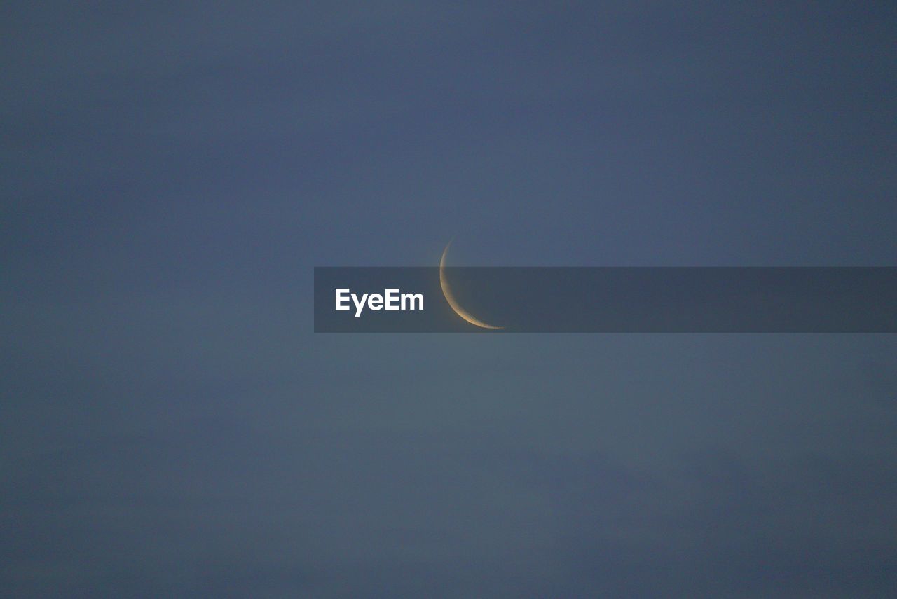 LOW ANGLE VIEW OF MOON AGAINST SKY AT NIGHT