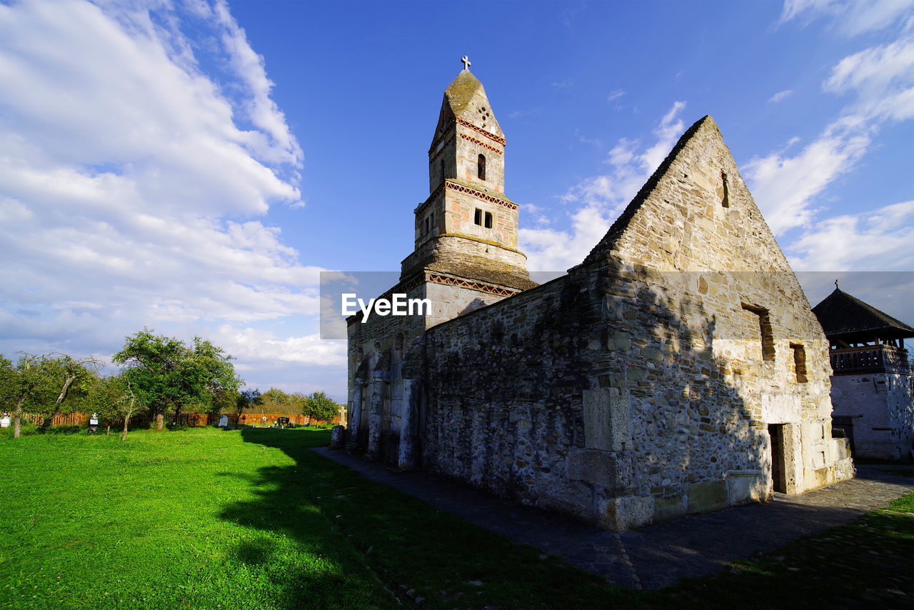 Low angle view of old church against sky