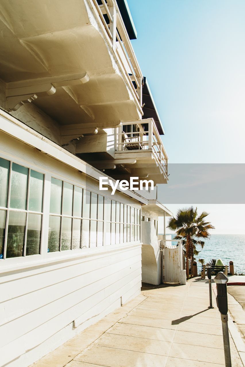 View of building by sea against sky