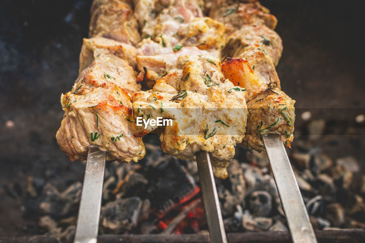 High angle view of meat on barbecue grill