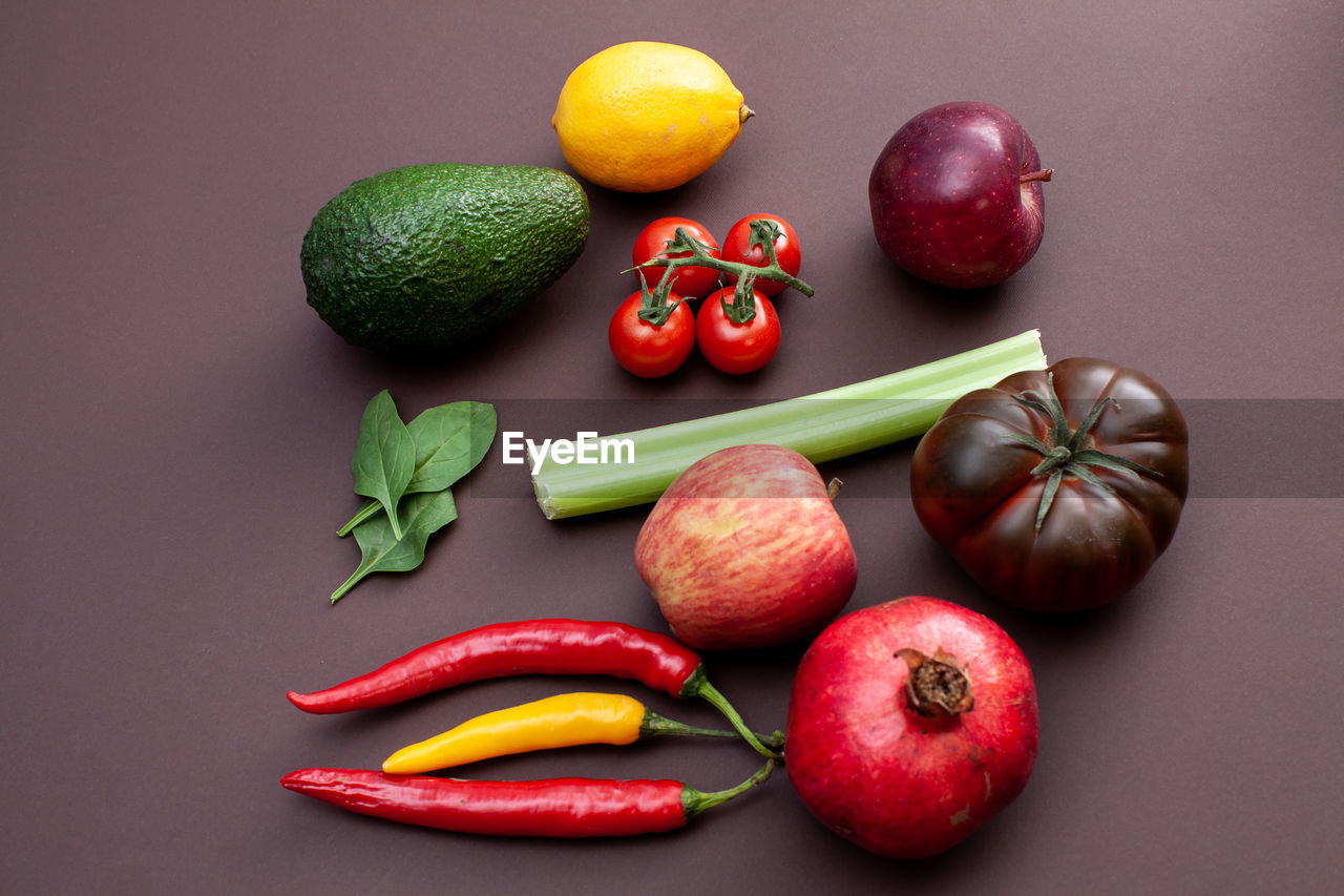 Fruits and vegetables on brown background
