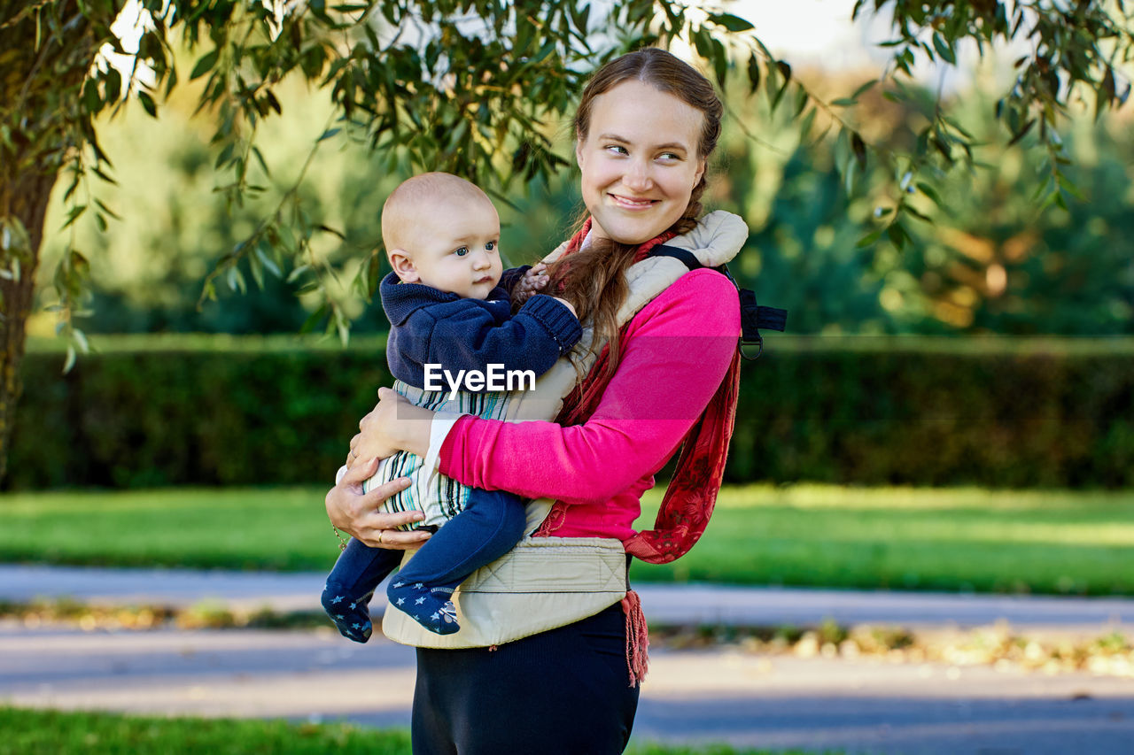 HAPPY MOTHER WITH BABY