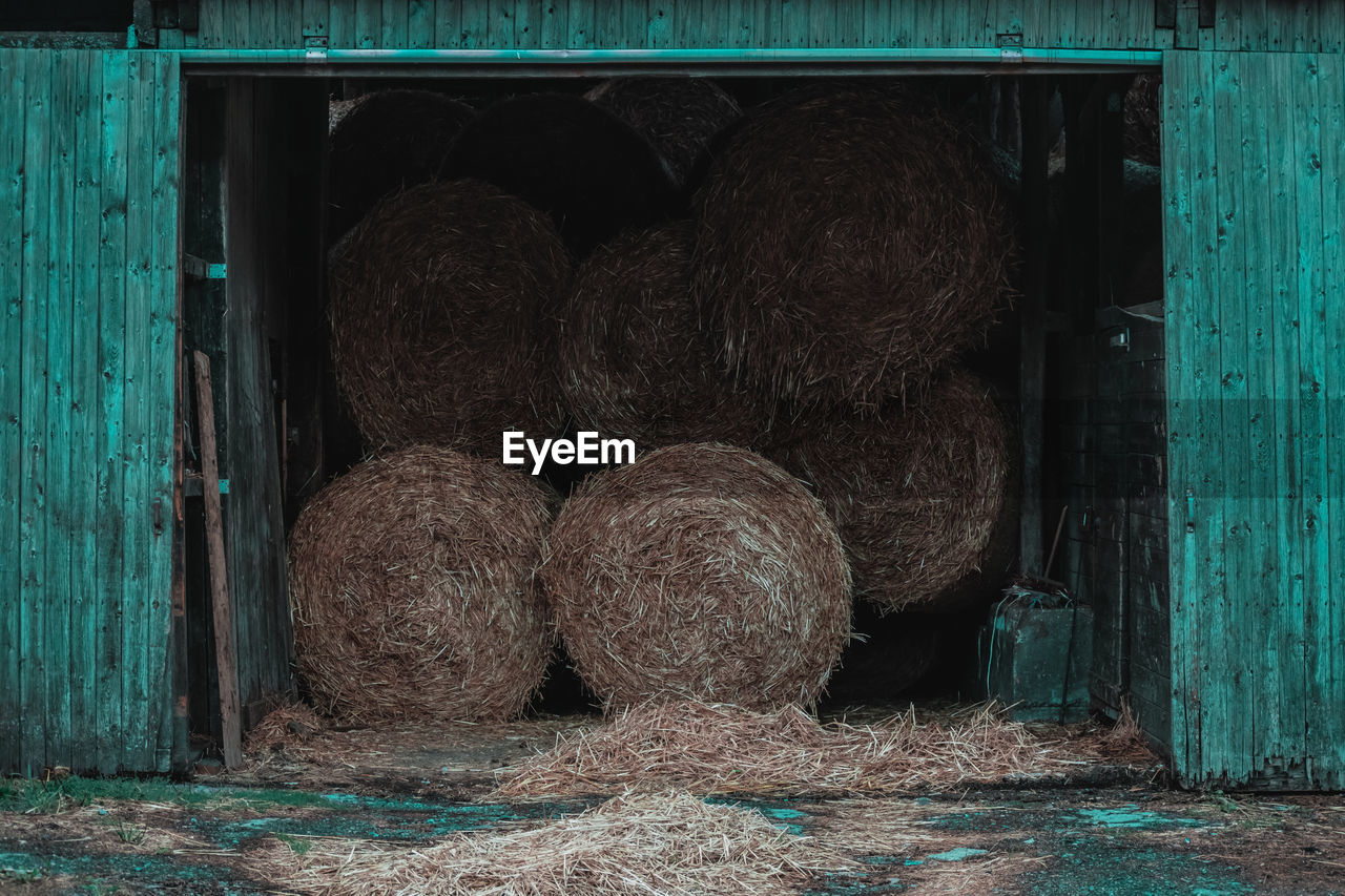 Stack of hay bales on field