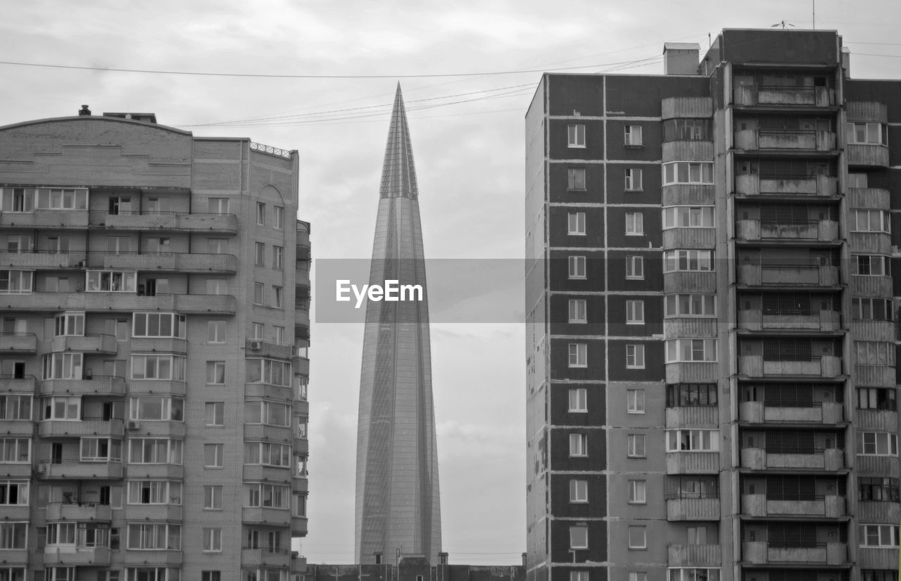 LOW ANGLE VIEW OF MODERN BUILDINGS AGAINST SKY