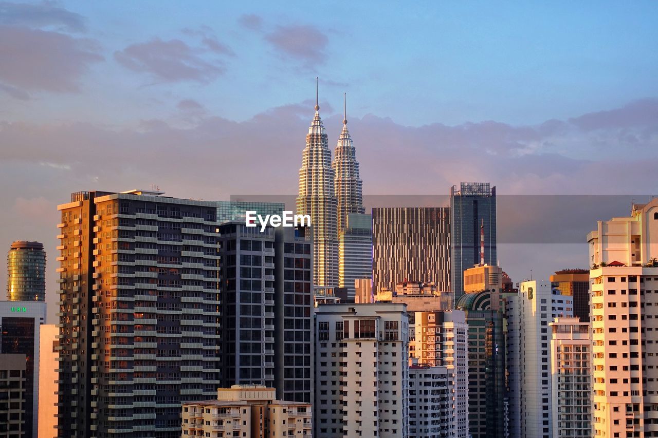 Modern buildings in city against sky