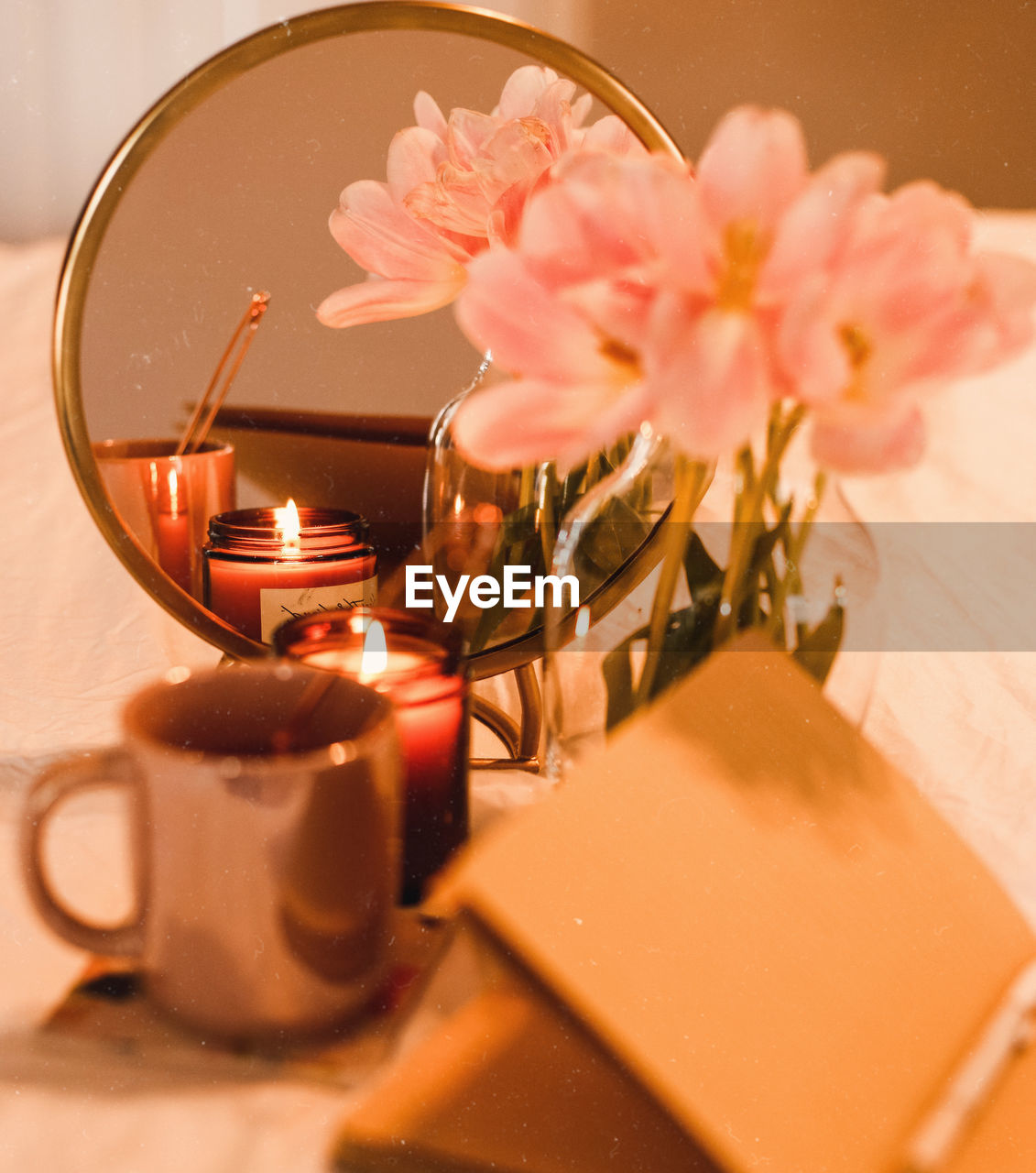 CLOSE-UP OF PINK FLOWER ON TABLE AT HOME