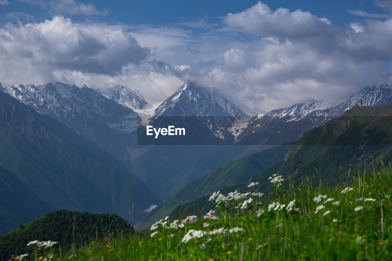 PANORAMIC VIEW OF SNOWCAPPED MOUNTAINS AGAINST SKY