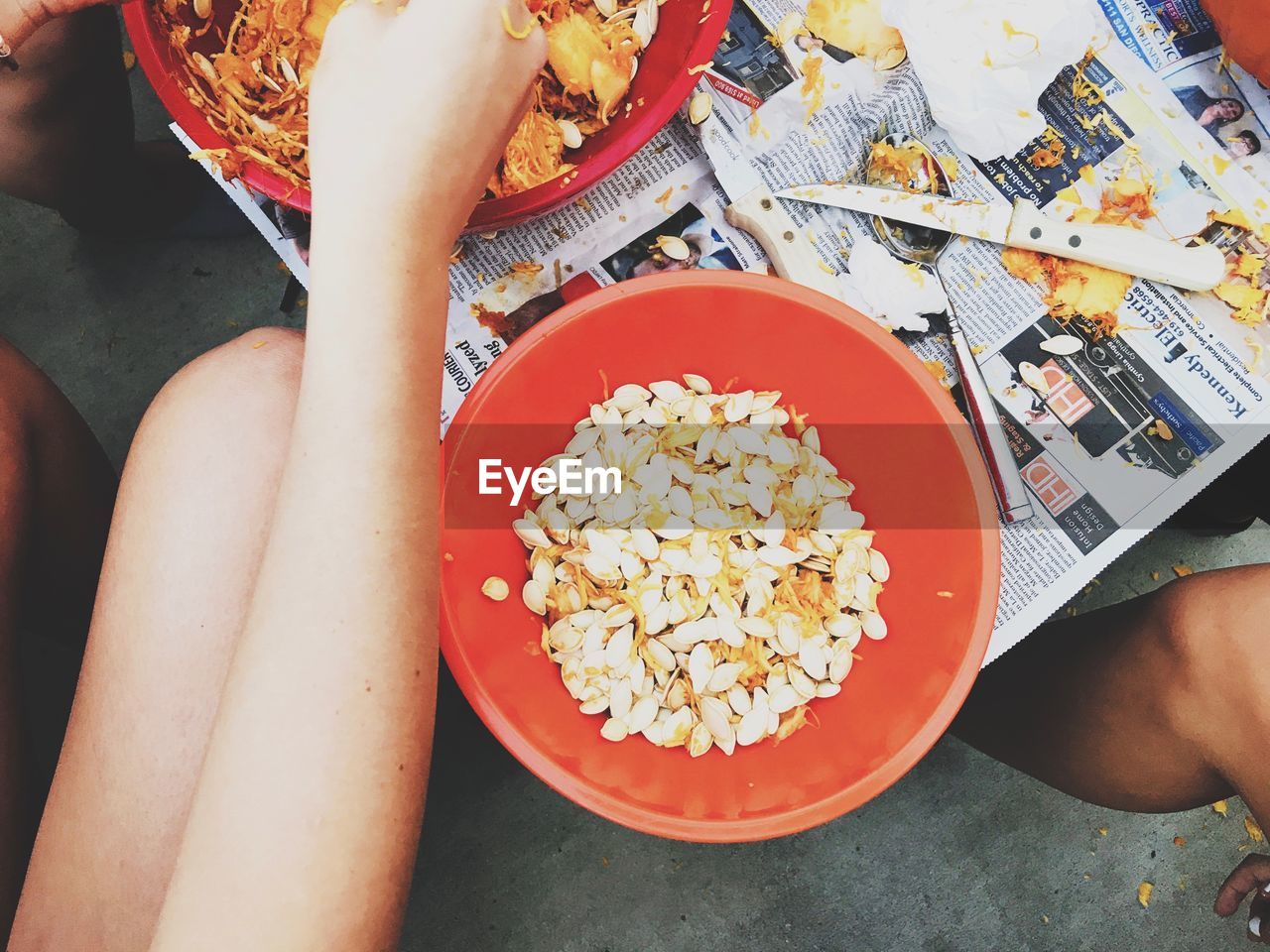 HIGH ANGLE VIEW OF WOMAN HOLDING FOOD