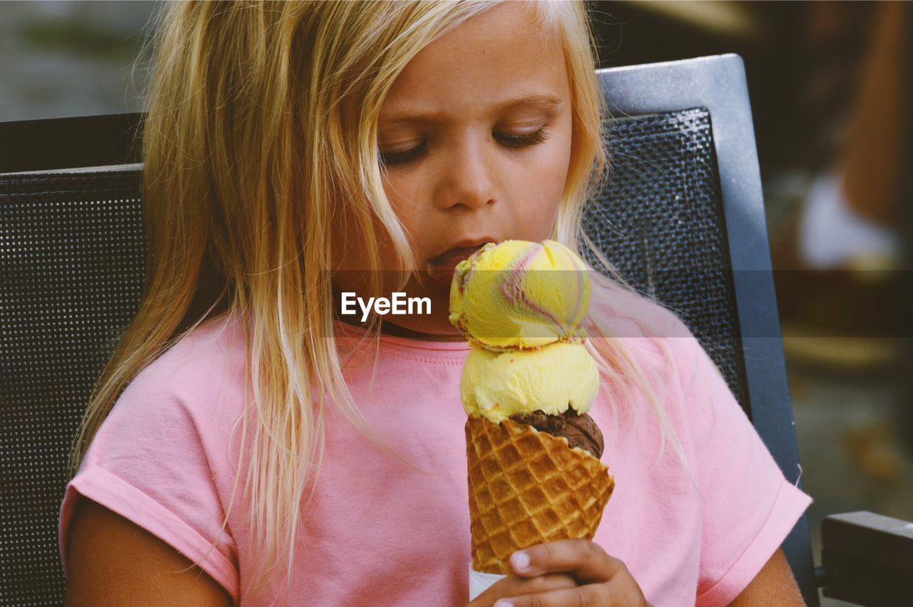 Close-up of girl eating ice cream cone