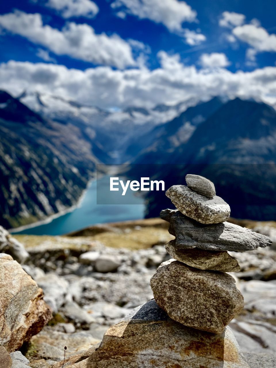 Stack of pebbles on mountain against sky