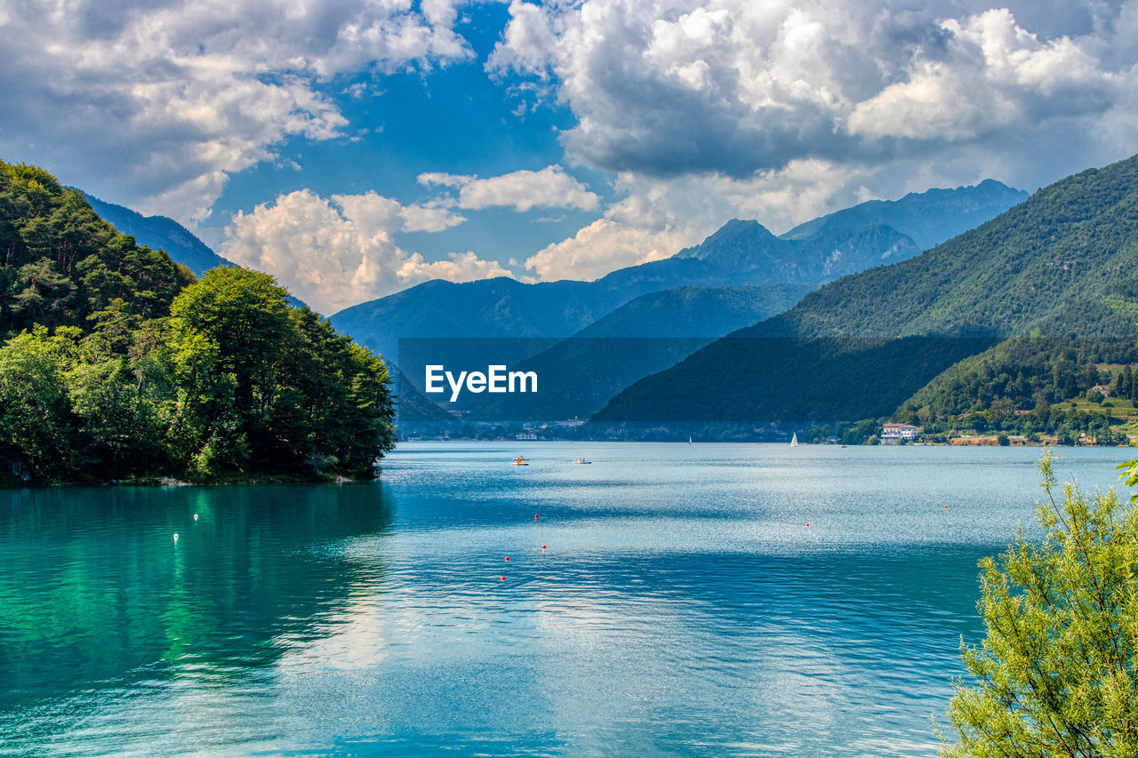 Scenic view of lake and mountains against sky