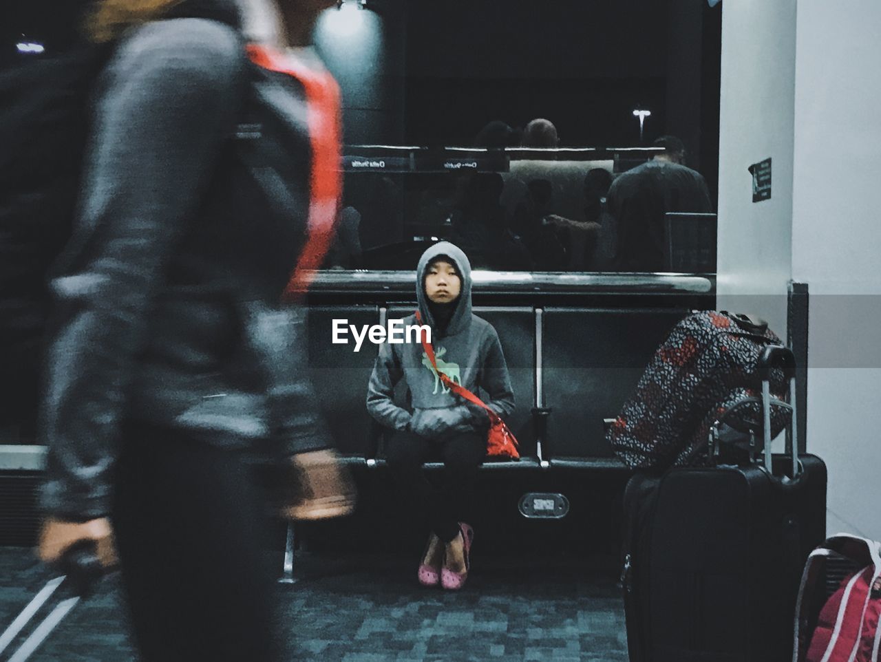 WOMAN WITH CAMERA WHILE STANDING ON SHELF