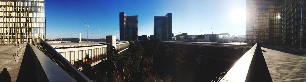 Built structures against clear blue sky