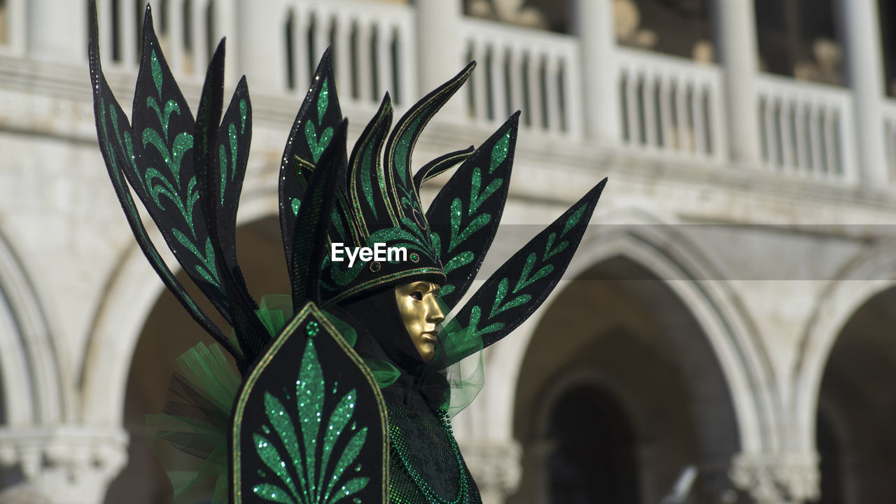 Person wearing costume and mask during carnival of venice