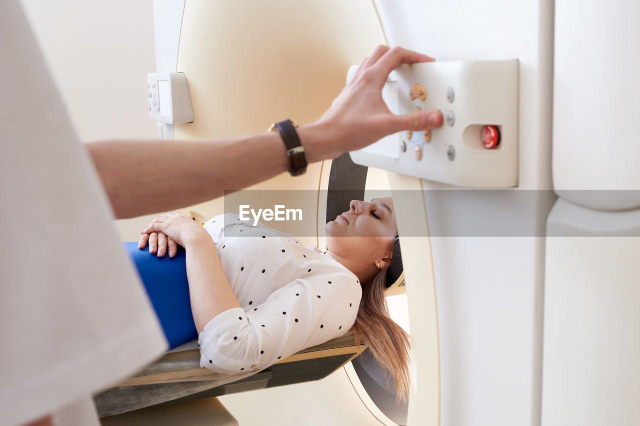 Doctor preparing patient for mri