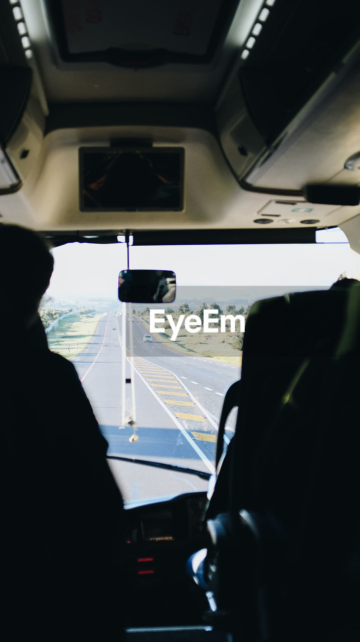 View of road seen through bus