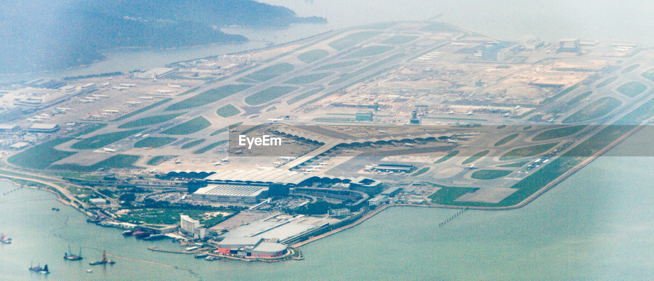 AERIAL VIEW OF CITYSCAPE AND AIRPLANE