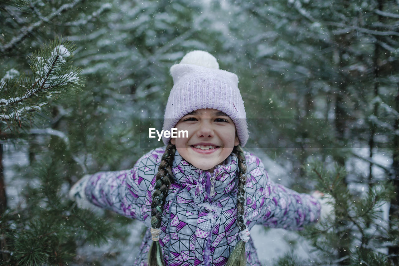 Portrait of smiling girl during winter
