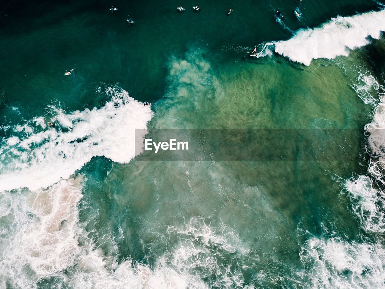 HIGH ANGLE VIEW OF WAVES ON BEACH