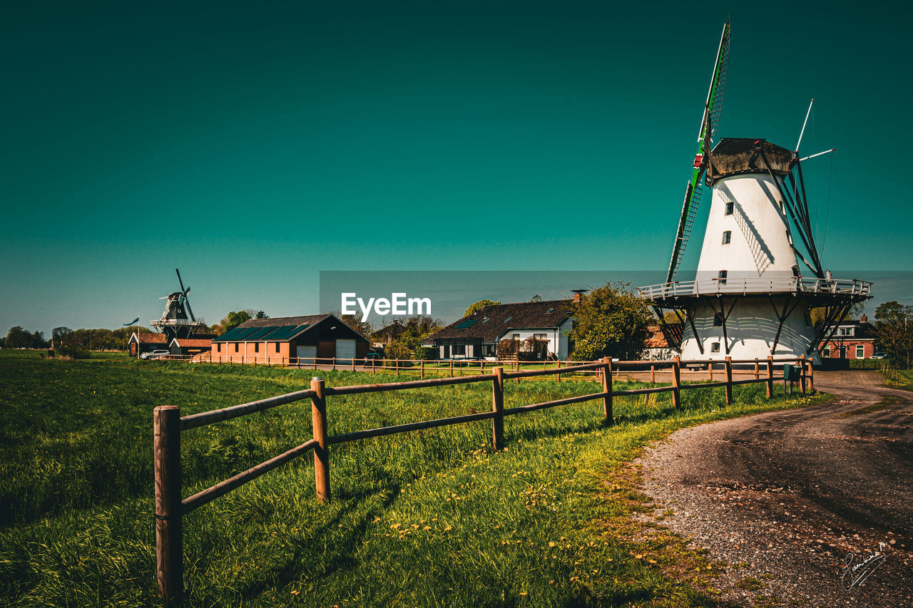 built structure on field against clear sky