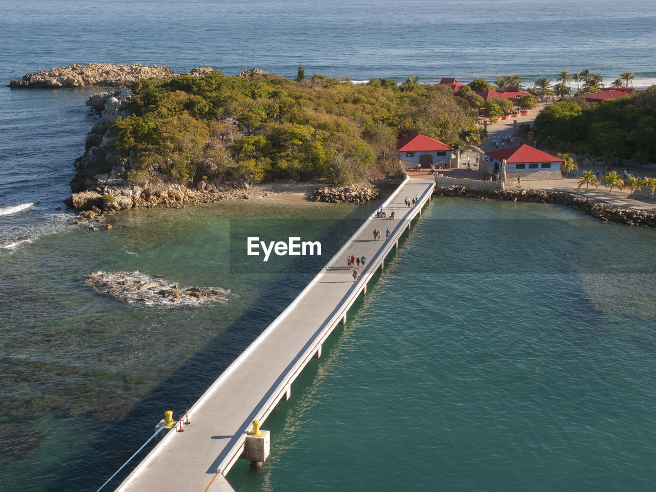 HIGH ANGLE VIEW OF HOUSES AND SEA