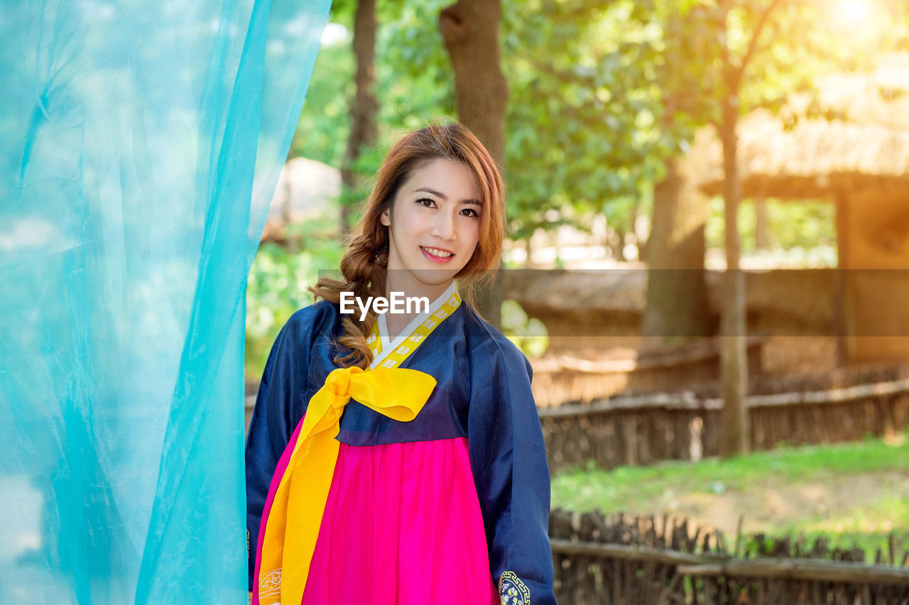 Portrait of smiling beautiful woman wearing hanbok
