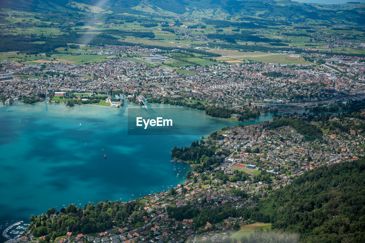 HIGH ANGLE VIEW OF TOWN BY SEA