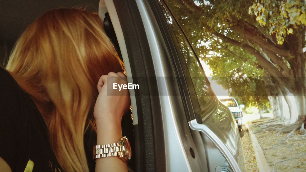 Woman sitting in car