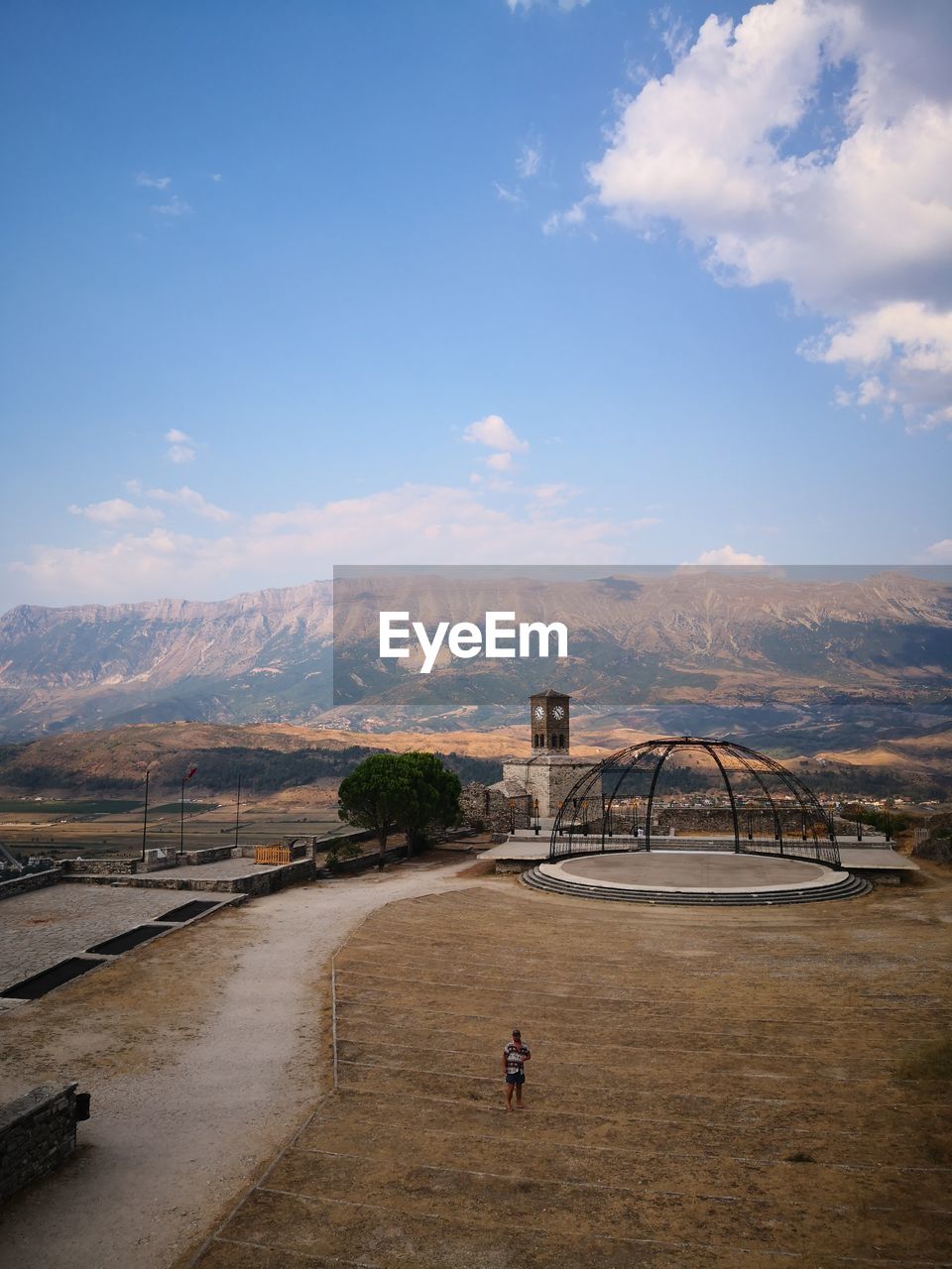 High angle view of woman standing on land against sky