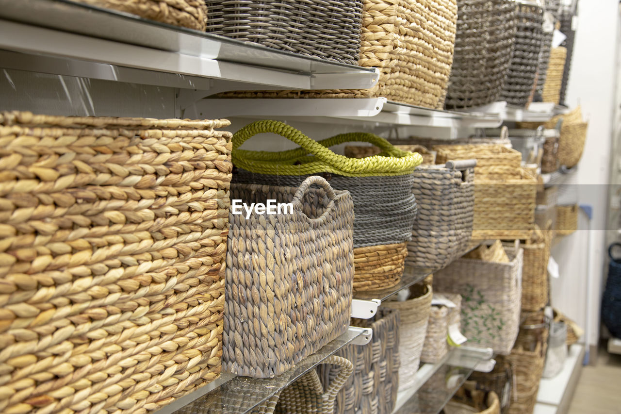 STACK OF WICKER BASKET AT MARKET