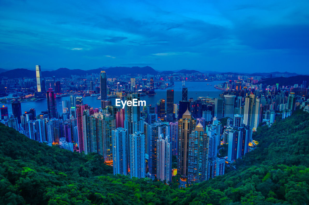 high angle view of buildings in city against sky