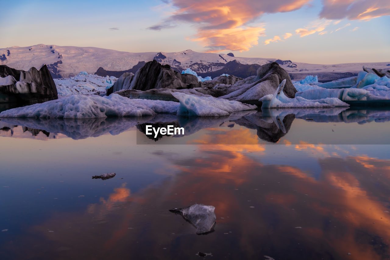 Icebergs and mountains on jokulsarlon glacial lagoon