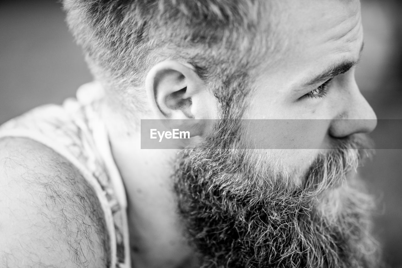 Side view of bearded man 