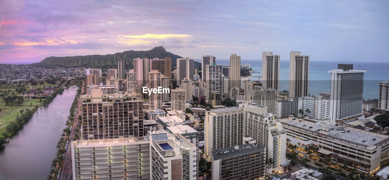 High angle view of modern buildings in city against sky